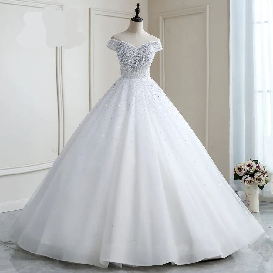 Vestido de Noiva Luxuoso com Pérolas - Elegância e Sofisticação